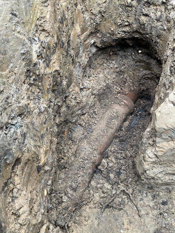 Conducted excavation to expose corroded cast iron sewer pipe for assessment. Documented significant surface deterioration and rust damage on the pipe, which will require replacement as recommended to customer Julio (referred by Jon H.).