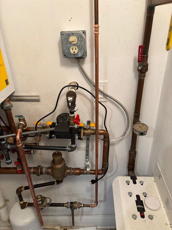 Completed partial work on heating system repair. Inspected copper piping system with circulation pump and multiple valves for proper operation. Need to return with heating expansion tank to complete the service as sold by Joey.