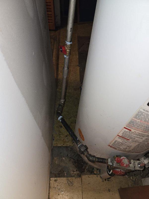 Completed gas line repiping project involving approximately 40 feet of gas pipe. Technician Jose returned with additional materials to complete the installation, connecting from the gas meter to the water heater with appropriate valves and fittings to ensure proper gas supply.