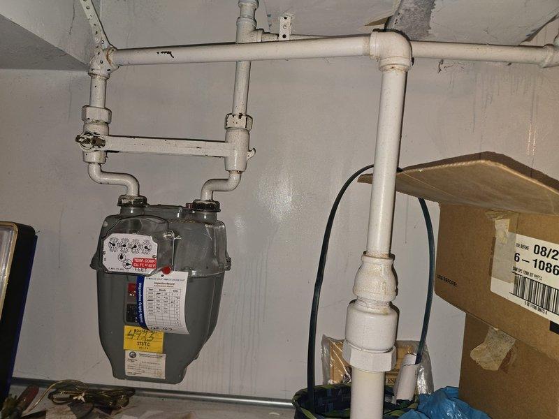 Completed gas line repiping project involving approximately 40 feet of gas pipe. Technician Jose returned with additional materials to complete the installation, connecting from the gas meter to the water heater with appropriate valves and fittings to ensure proper gas supply.