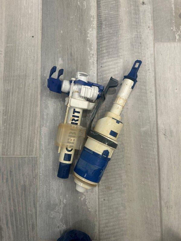 Replaced worn toilet fill valve and flush valve assembly in customer's toilet. Removed old components and installed new FLIT system with blue attachment clips. Verified proper function after installation. Service sold by Chris.