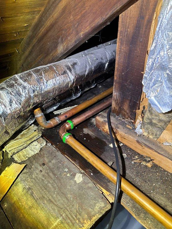 Inspected reported burst pipe issue affecting living room ceiling. Upon examination in the crawl space, found copper pipes with green connector joints running alongside HVAC ducting. Identified and repaired the leaking section of copper piping. No connection to boiler system as customer suspected. All plumbing now functioning properly with no active leaks observed.