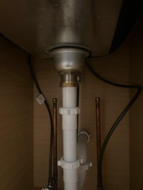 Responded to priority service call for a leaking butler's pantry sink. Diagnosed separation of sink seal on underside which customer had unsuccessfully attempted to repair with plumber's putty. Replaced damaged seal and reassembled drain assembly with proper sealing technique. Performed water test with running faucet to verify complete resolution of leak.