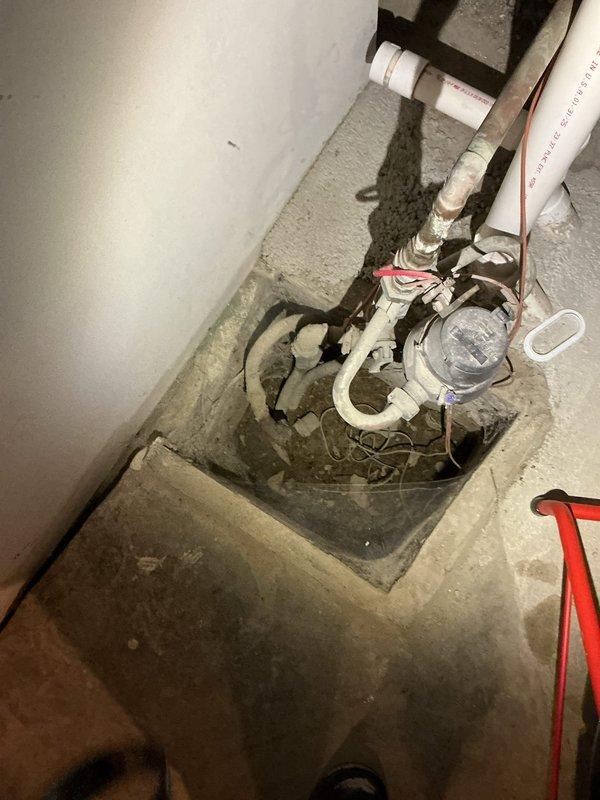 Responded to service call regarding previously capped catch basin with water seepage through concrete. Inspected the installation area in the fitness room with interlocking exercise flooring. Examined the square opening in concrete floor containing water meter and PVC piping system. No further remediation required as system functioning properly after inspection.