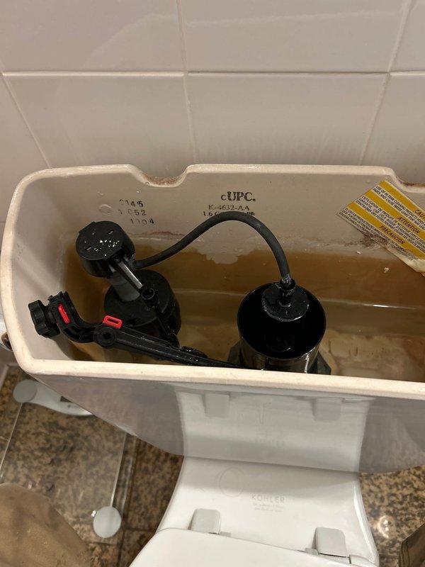 Responded to service call for toilet with malfunctioning flush mechanism. Upon inspection of tank interior, identified loose connection between flush valve assembly and chain. Repaired and secured the flushing components, adjusted water level, and verified proper operation. Unit now functioning correctly.