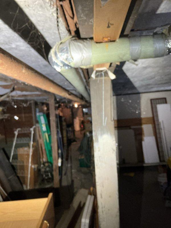Performed inspection of 40-gallon water heater installed in 2013 that has ceased to produce hot water as of yesterday. Observed significant deterioration around pipe penetrations with cracking and crumbling material. Noted galvanized metal pipes showing age-related wear. Evaluated PVC piping system in utility area with particular attention to connection points. Provided customer with replacement options for the failing unit.
