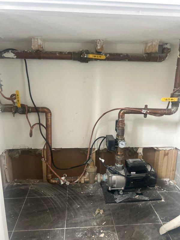 Responded to service call for pipe leak in lobby area. Upon inspection, identified issue with copper pipe system connected to circulation pump in utility room. Repaired leak and verified proper operation of pressure system, with all valves and gauge now functioning correctly.