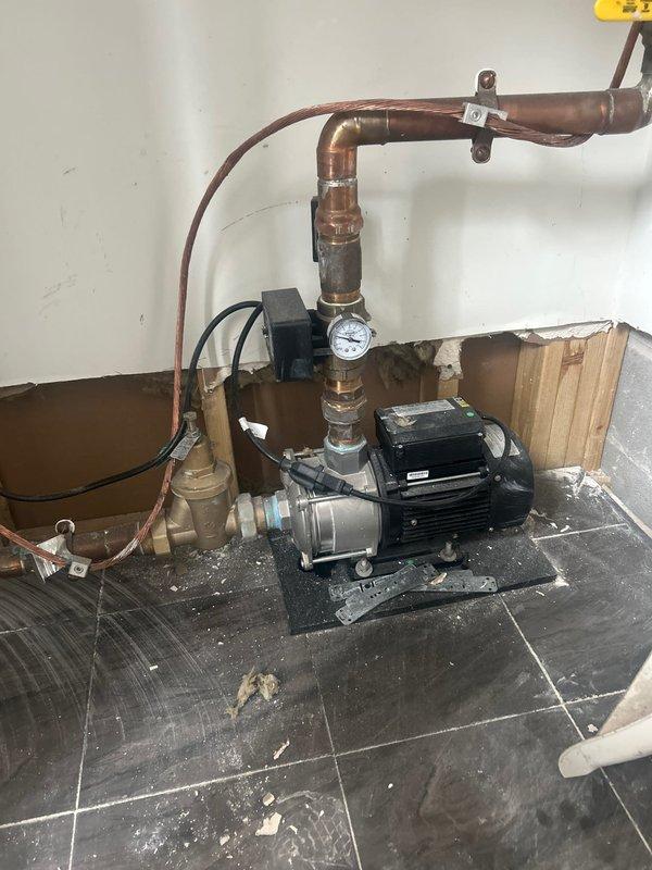 Responded to service call for pipe leak in lobby area. Upon inspection, identified issue with copper pipe system connected to circulation pump in utility room. Repaired leak and verified proper operation of pressure system, with all valves and gauge now functioning correctly.