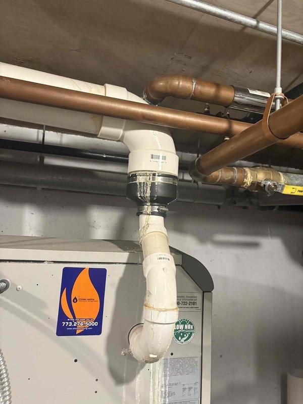 Completed service call back to inspect plumbing infrastructure in utility area. Examined copper and PVC piping system including P-trap configuration, checking connections between different pipe materials for proper sealing. Inspected expansion tank (EXTROL) and associated valves, noting minor water staining on adjacent wall that will require monitoring.