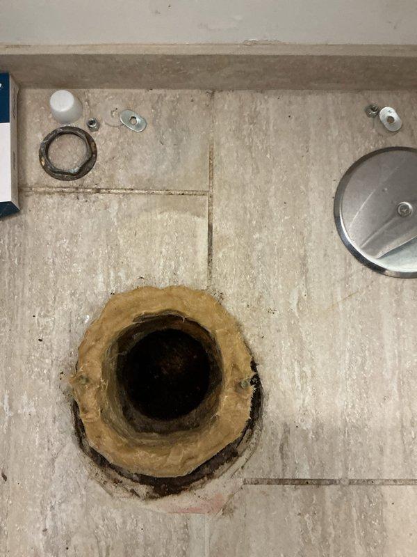 Arrived early morning during scheduled building shutdown to perform toilet installation. Removed old wax ring and prepared floor flange for new toilet mounting. Installed new wax seal and properly secured fixture to floor using appropriate mounting hardware and metal rings. Job completed with all connections properly sealed and tested.