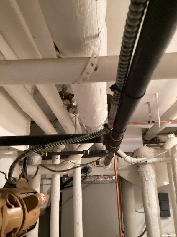 Responded to service call for clogged drain/sink. Inspected kitchen sink P-trap assembly and drainage system. Observed water staining on cabinet floor indicating previous minor leakage. Also examined basement plumbing infrastructure, noting deteriorated pipe insulation that requires attention. Cleared blockage and verified proper drainage function.