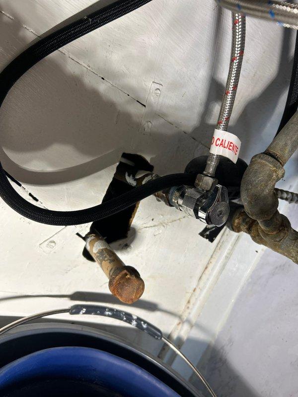 Responded to a rescheduled priority service call for kitchen sink leak. Upon inspection, identified corrosion on copper supply lines and failing valve assembly. Replaced damaged sections of piping, installed new braided supply lines, and replaced valve assembly to resolve the leak issue.