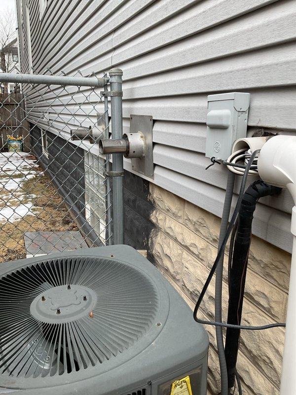 Responded to service call for tankless water heater system. Inspected dual Rheem tankless units mounted in basement (labeled "1st Fl." and "2nd Fl.") with associated copper and PVC piping. Performed maintenance check on exterior components including condenser unit and electrical connections. Service was sold by Jose.