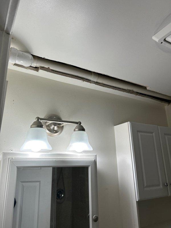 Installed new tankless water heater, requiring wall access to connect PVC drainage system. Performed necessary plumbing modifications including connection to existing drain line with PVC elbow joint. Identified ceiling pipe damage during inspection and documented condition for future reference. All parts supplied by Joey were installed according to manufacturer specifications.