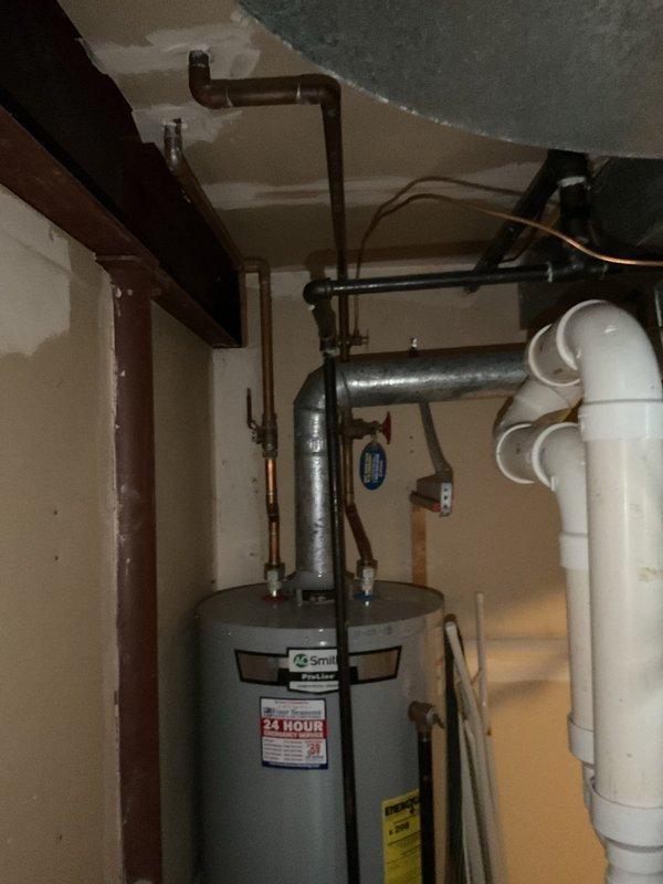 Performed assessment for upgrading existing tank water heater to tankless system per customer request. Inspected current installation including connections, venting, and available space for conversion. Also evaluated persistent master bathroom shower drain clog reported by customer as ongoing for 2-3 months.