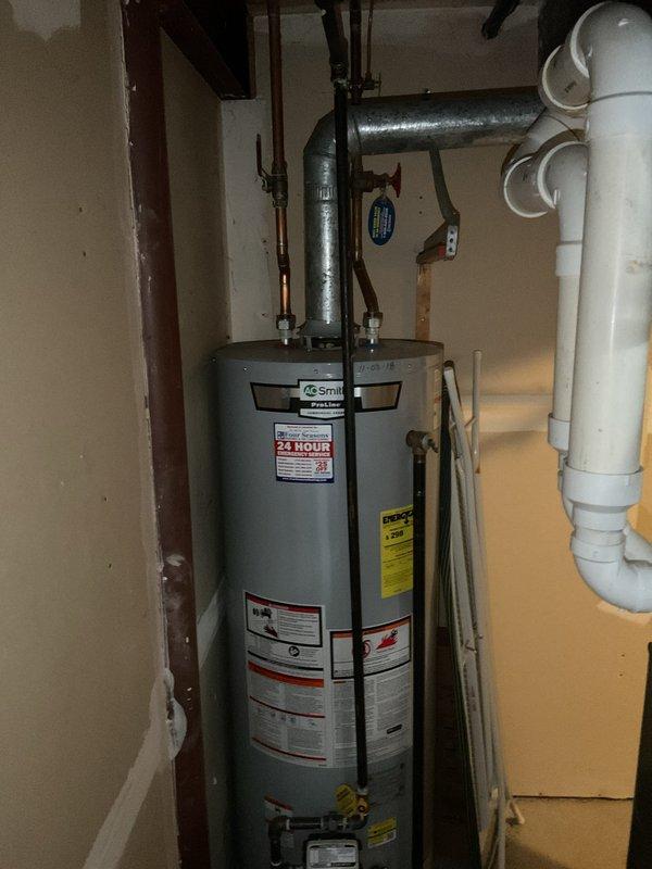 Performed assessment for upgrading existing tank water heater to tankless system per customer request. Inspected current installation including connections, venting, and available space for conversion. Also evaluated persistent master bathroom shower drain clog reported by customer as ongoing for 2-3 months.