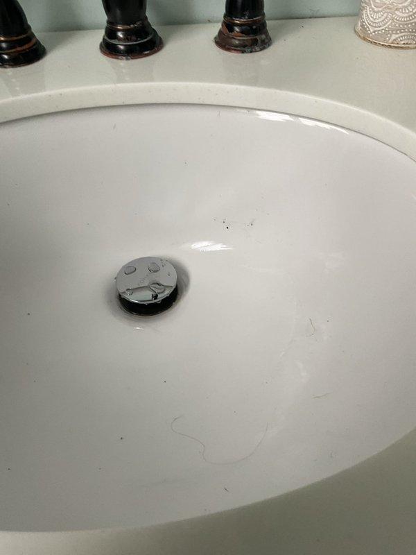 Responded to service call for completely backed up bathroom sink that began the previous day. Upon arrival, observed standing water in the sink basin with minor debris. Successfully cleared the clogged drain using professional snaking equipment, restoring proper drainage function. Completed final testing to confirm full water flow and proper drain operation.