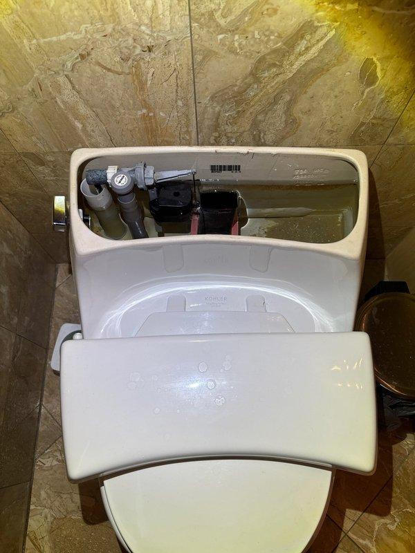Responded to urgent service call for two slow-filling upstairs toilets. Inspected Kohler model K3386DA with suspected fill valve issues. Removed tank lids to examine internal components and found mineral buildup on the Kohler model 703 fill valves. Cleaned and adjusted the fill valve mechanisms to restore proper water flow and tank filling operation in both toilets.