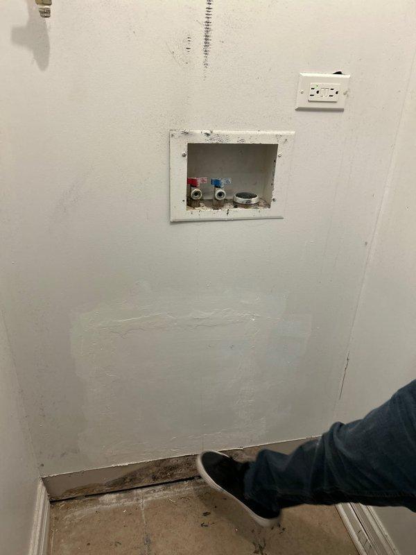 Responded to customer report of leaky pipe. Inspection revealed water seepage from valve connections in wall access panel containing hot and cold water supply lines. Repaired leaking valve fitting on copper pipe in crawlspace, cleaned accumulated moisture in drain pan, and verified proper system operation with no further leakage.