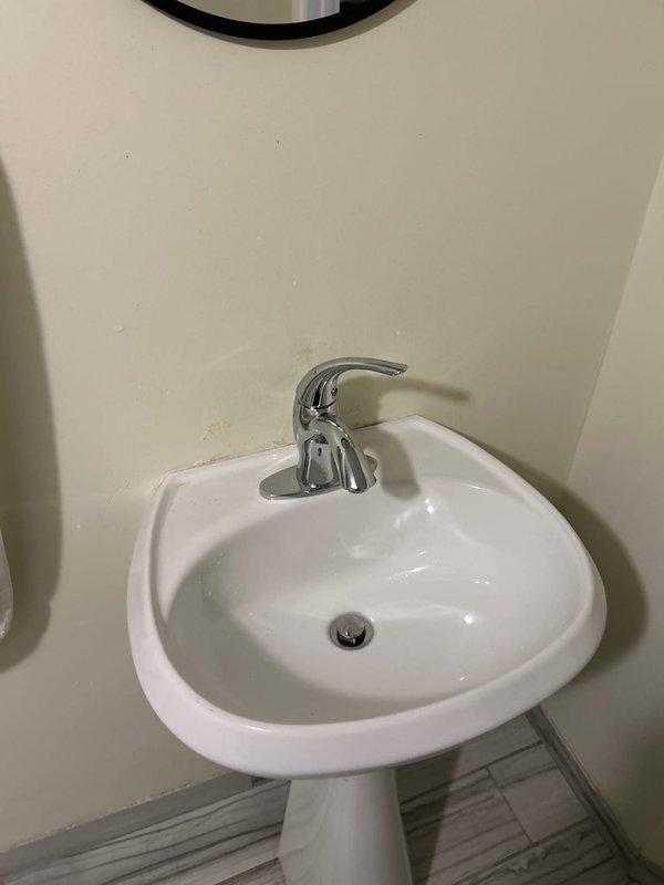 Diagnosed and repaired basement bathroom sink faucet with intermittent water flow issues. Identified faulty valve assembly causing water to initially flow slowly before stopping completely. Replaced valve components and verified proper water flow restoration with no leaks.