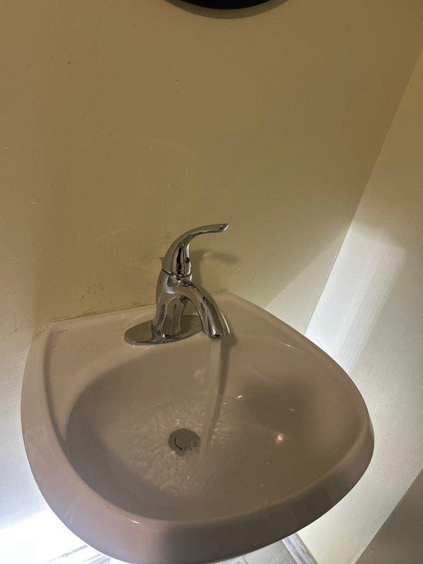 Diagnosed and repaired basement bathroom sink faucet with intermittent water flow issues. Identified faulty valve assembly causing water to initially flow slowly before stopping completely. Replaced valve components and verified proper water flow restoration with no leaks.