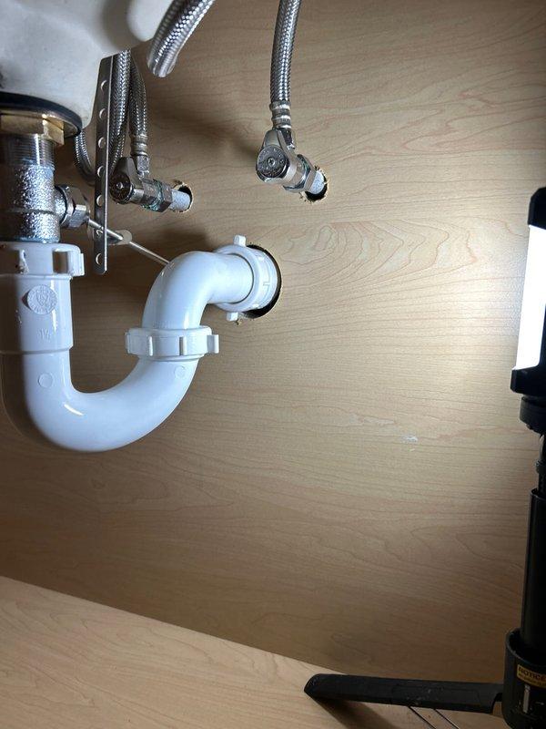 Completed installation of customer-provided faucet with new supply lines. Installed and secured P-trap drain assembly with proper connections. All components verified for proper fit and function with no leaks observed.