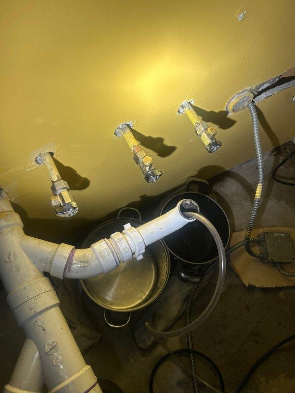Responded to priority call regarding a leak behind kitchen sink wall. Upon inspection, identified damaged plumbing connections requiring immediate attention. Removed damaged section of piping, installed new PVC drain trap assembly with proper mounting brackets against wall, and verified system integrity. Leak successfully repaired with no further moisture issues detected.
