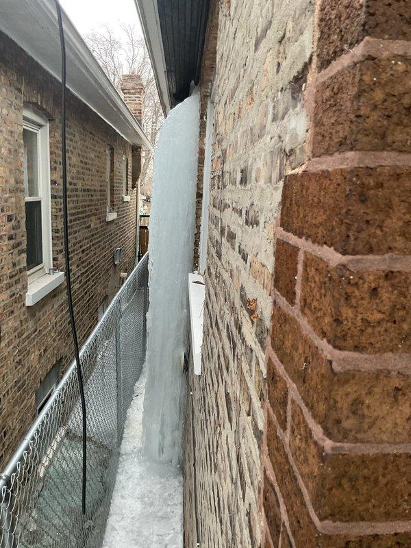 Responded to emergency service call for burst pipe. Discovered significant water leakage between buildings that had frozen into a substantial ice formation. Inspection revealed corroded copper pipe with failed joints in the utility area. Replaced damaged section of pipe, installed new fittings, and restored water service to the property.