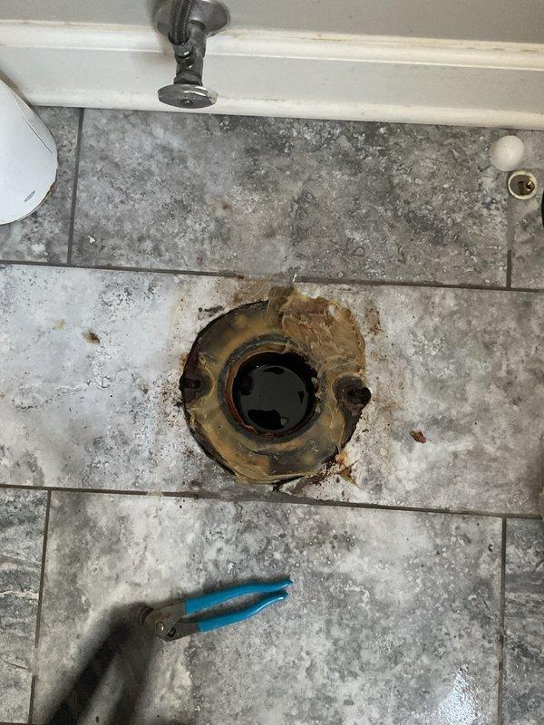 Responded to service call for toilet not flushing correctly and filling to rim. Removed existing toilet to access flange, which showed visible corrosion. Installed new wax ring and reset toilet after clearing drain line. Tested flushing operation to confirm proper water level and function.
