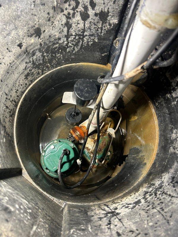 Diagnosed and repaired a sump pump system with recurring alarm issue despite recent battery replacement. Identified faulty control module as the cause of false alarms and replaced it, ensuring proper communication between the battery backup system and primary pump. System now functioning correctly with no alarm conditions.