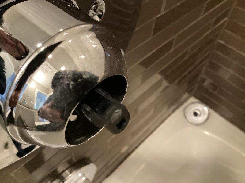 Inspected bathroom fixtures including chrome showerhead/faucet and sink fixture. Confirmed parts have arrived for installation. Job ready to be scheduled for completion.