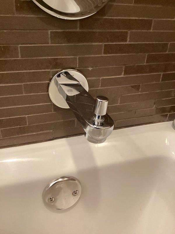Inspected bathroom fixtures including chrome showerhead/faucet and sink fixture. Confirmed parts have arrived for installation. Job ready to be scheduled for completion.
