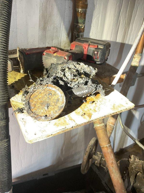 Completed sold repair job as scheduled (ACH payment confirmed prior to appointment). Replaced damaged Husky tool component that showed severe charring. Work area required extensive cleanup due to accumulated debris and dust around copper piping system. Documented repair with photos showing the damaged equipment and completed work.