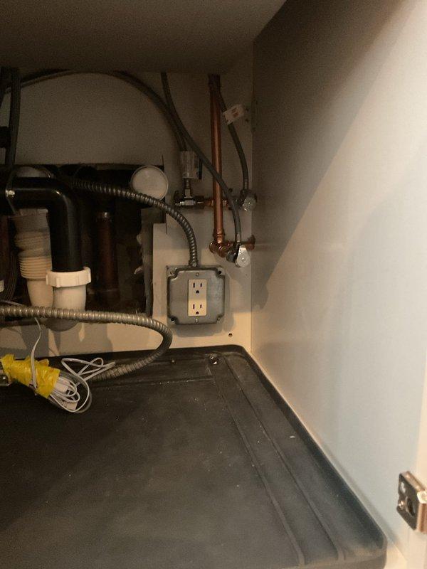 Completed sold repair job involving copper pipe work in a utility installation area. Accessed plumbing system through ceiling/wall opening, working around existing electrical components and insulation. Photo documentation taken of repair site before and after service completion.