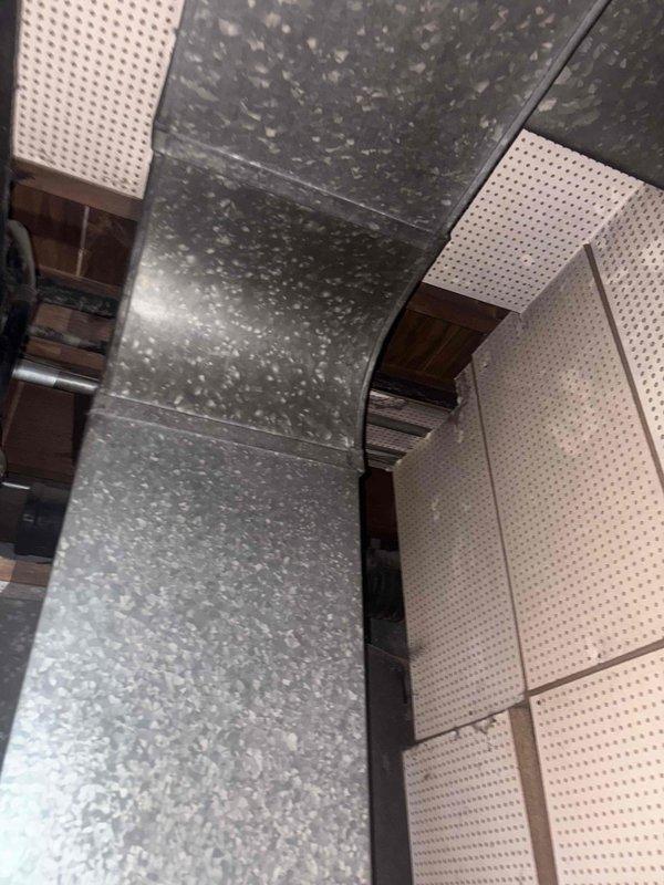 Inspected shared hot water system in 13-unit building to diagnose intermittent hot water delivery issues affecting multiple units. Examined distribution lines and ventilation components. Issue appears to be ongoing for over a year; comprehensive system assessment recommended to determine appropriate remediation strategy.