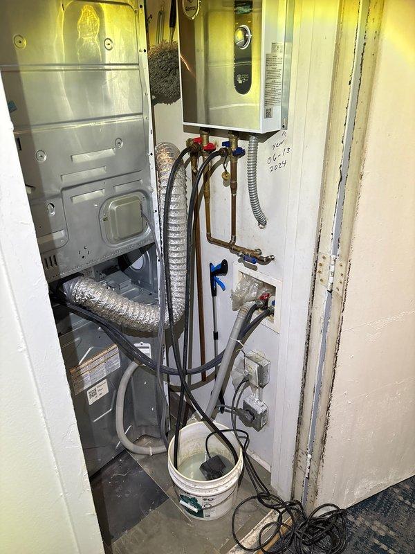 Responded to a callback service request for shower fixture inspection. Upon assessment, found a chrome lever-style handle shower fixture with mineral deposits and surface wear. Inspected associated plumbing connections in the utility closet, which contains copper pipes with hot and cold water valves. Verified proper function of the fixture and connections, ensuring no leaks or pressure issues were present.