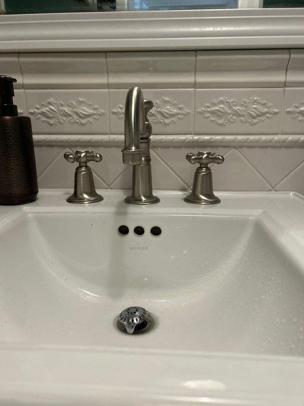 Located and repaired two minor leaks - one in the powder room sink involving the faucet assembly and drain connections, and another in the kitchen faucet. Disassembled, inspected, and reassembled the bathroom fixture components to ensure proper sealing and function.