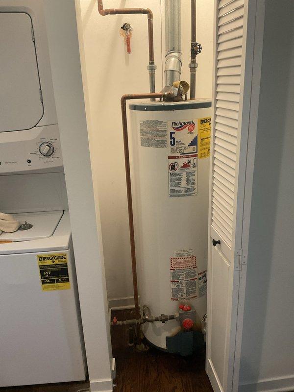 Responded to VIP service call for 40-year-old 40-gallon water heater leaking from tank bottom. Visual inspection confirmed tank failure with significant corrosion at base. Replaced unit with new code-compliant water heater, including installation of proper venting, copper supply lines, and shut-off valve. Verified operation and leak-free connections before completing service.