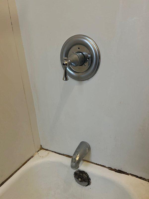 Completed shower valve service by removing and replacing damaged trim components. Extracted worn retainer ring from valve assembly. Job was originally sold by Jacob and documented with before/after photos of the repair.