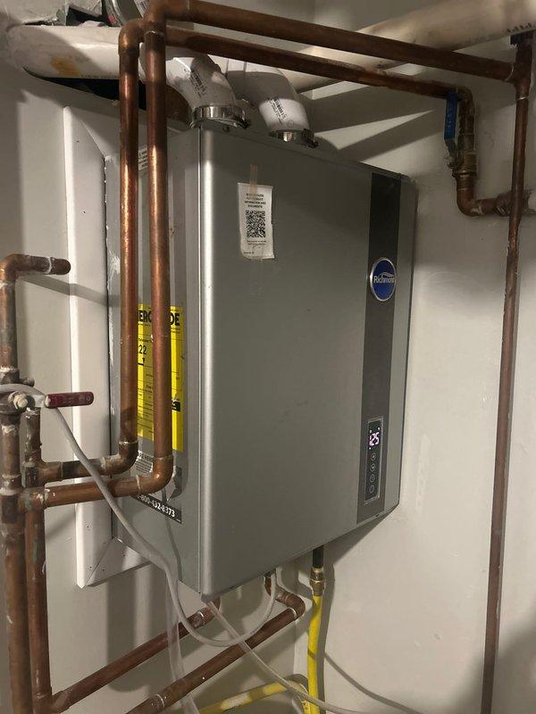 Inspected existing tankless water heater system and evaluated recirculation setup. Installed crossover valve with timer under sink to improve hot water delivery efficiency. Upgraded existing recirculating pump with retrofit components to optimize performance with the tankless system.