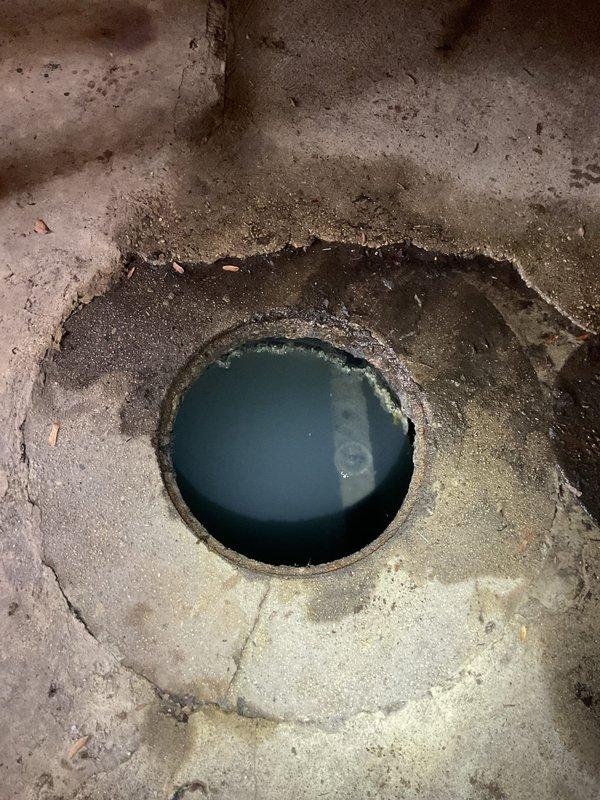 Conducted scheduled sewer maintenance service including rodding/jetting of main sewer line and cleaning of kitchen stacks at commercial property. Inspection revealed significant water pooling and deterioration around floor drain in basement utility area, indicating previous backup issues. Successfully cleared blockages and restored proper drainage function to prevent future flooding.