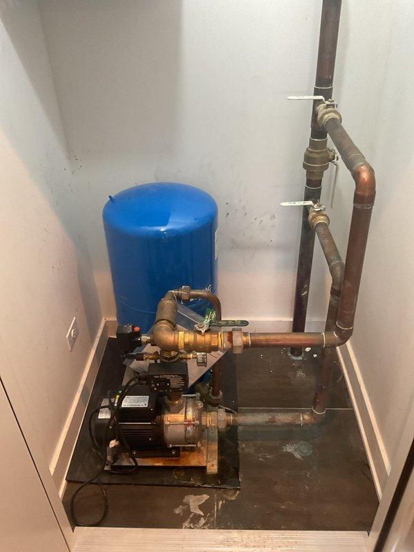 Inspected commercial water treatment system with non-functional booster pump. Identified pump failure as cause of low building water pressure. Recommended complete replacement of existing pump unit to restore proper system operation and pressure levels.
