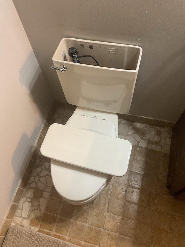 Successfully installed customer-supplied toilet in residential bathroom during afternoon appointment. Completed proper fitting and connection of tank to bowl assembly, secured unit to floor flange, and verified proper water supply connection. Final inspection confirmed toilet functioning correctly with no leaks at supply line or base connections.