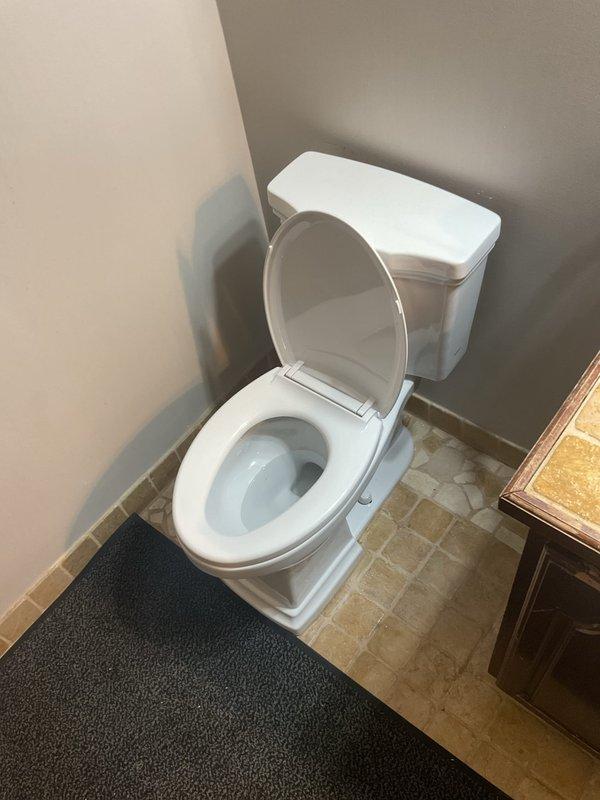 Successfully installed customer-supplied toilet in residential bathroom during afternoon appointment. Completed proper fitting and connection of tank to bowl assembly, secured unit to floor flange, and verified proper water supply connection. Final inspection confirmed toilet functioning correctly with no leaks at supply line or base connections.