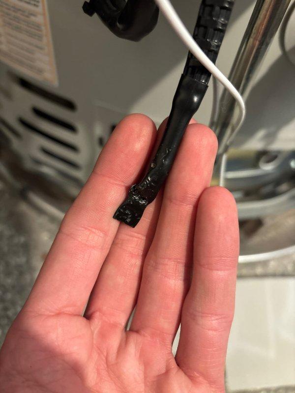 Diagnosed water heater displaying 7 flash error code with no hot water production. Inspection revealed damaged thermopile/thermocouple assembly with deteriorated connector. Replaced defective component to restore proper ignition sequence and hot water functionality.