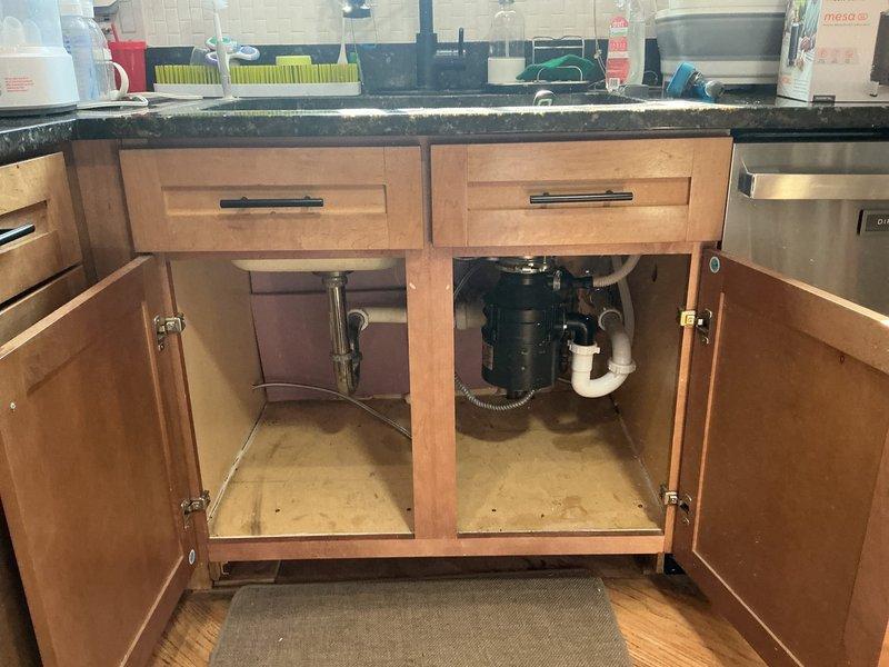 Responded to service call for garbage disposal issues and catch basin drainage. Upon inspection, discovered deteriorated insulation inside wall cavity near disposal unit, which was affecting proper functioning. Removed debris, cleaned the disposal system, and performed a sewer scope to clear the catch basin drainage issue, restoring normal operation to the kitchen plumbing system.