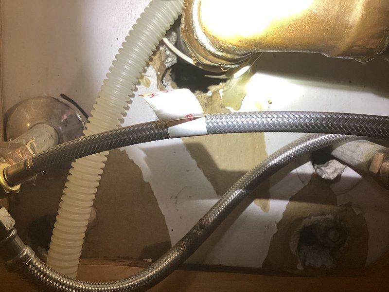 Responded to service call for burst pipe under sink. Inspected plumbing system and found damaged supply line with signs of water exposure and minor corrosion around fittings. Replaced the compromised braided supply line and checked all connections to ensure proper function and prevent future leaks.