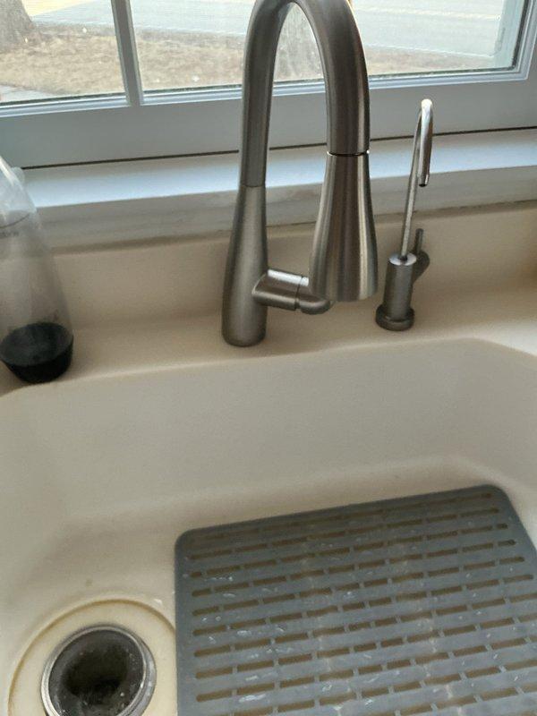 Successfully installed customer-supplied kitchen faucet in challenging narrow space with deep sink configuration. Properly connected new faucet to existing water supply lines and drain assembly, ensuring all connections were secure with no leaks. Verified full functionality of the pull-down sprayer and secondary fixture before completing service.