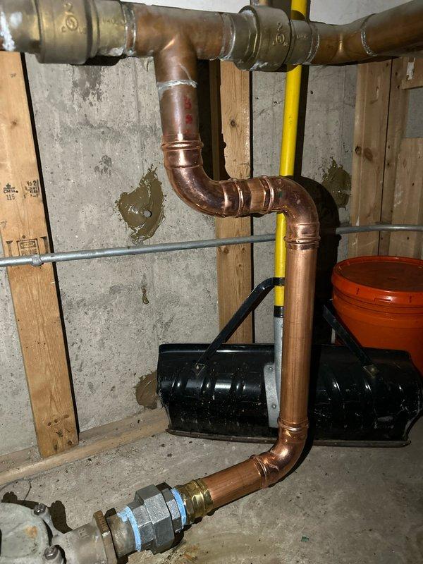 Completed installation of copper piping system in utility area, including soldered joints and connections to existing infrastructure. Installed brass Legend valve assembly with blue handle and flow meter/indicator as specified in the sold repair. All connections were properly secured and system was tested for proper operation.