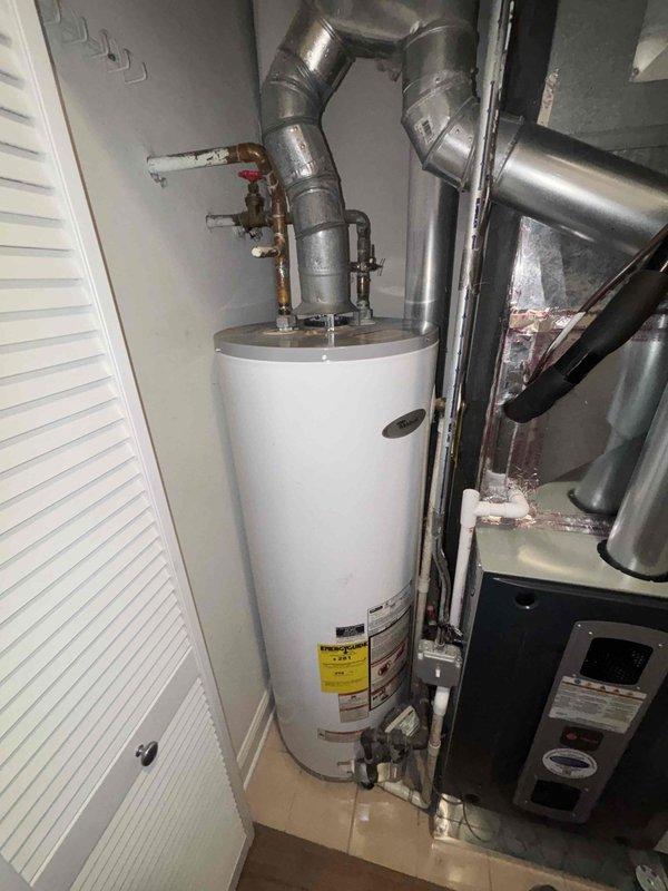Responded to a water leak service call involving a residential water heater system. Upon inspection, identified mineral buildup and oxidation around copper pipe connections at the top of the water heater tank, which was causing seepage. Cleaned affected connections, tightened fittings, and verified proper operation of the pressure relief valve and associated plumbing components to resolve the leak issue.